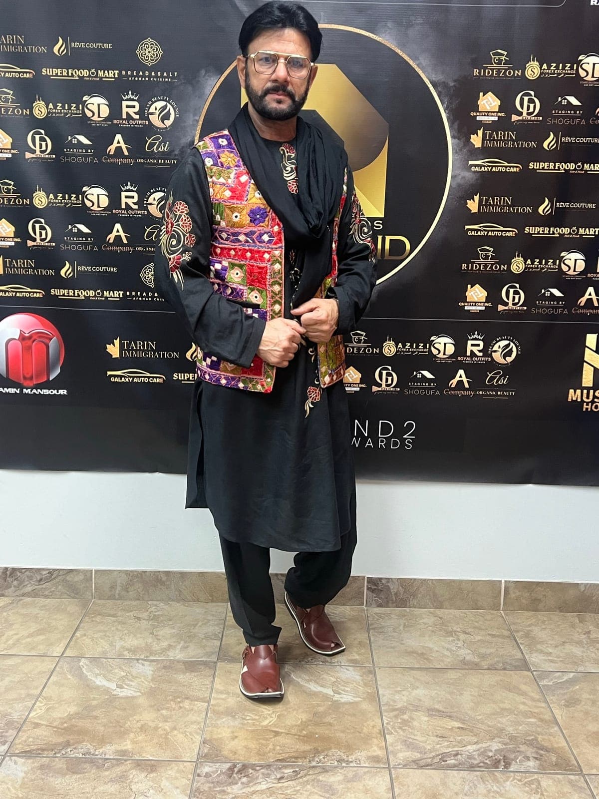 Taher Shubab at the Diamond Music Awards in an embroidered Afghan vest